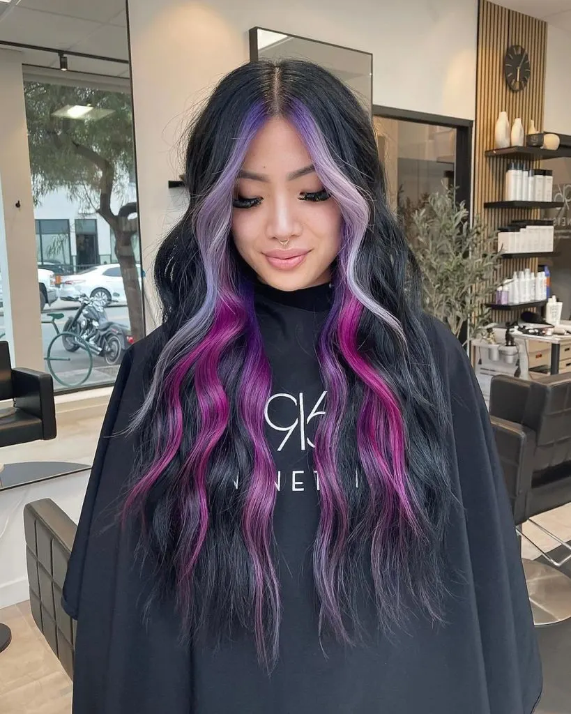 purple face-framing highlights on black hair