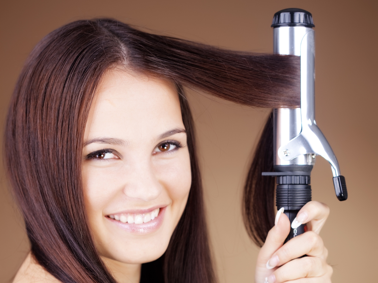 woman curling fine hair