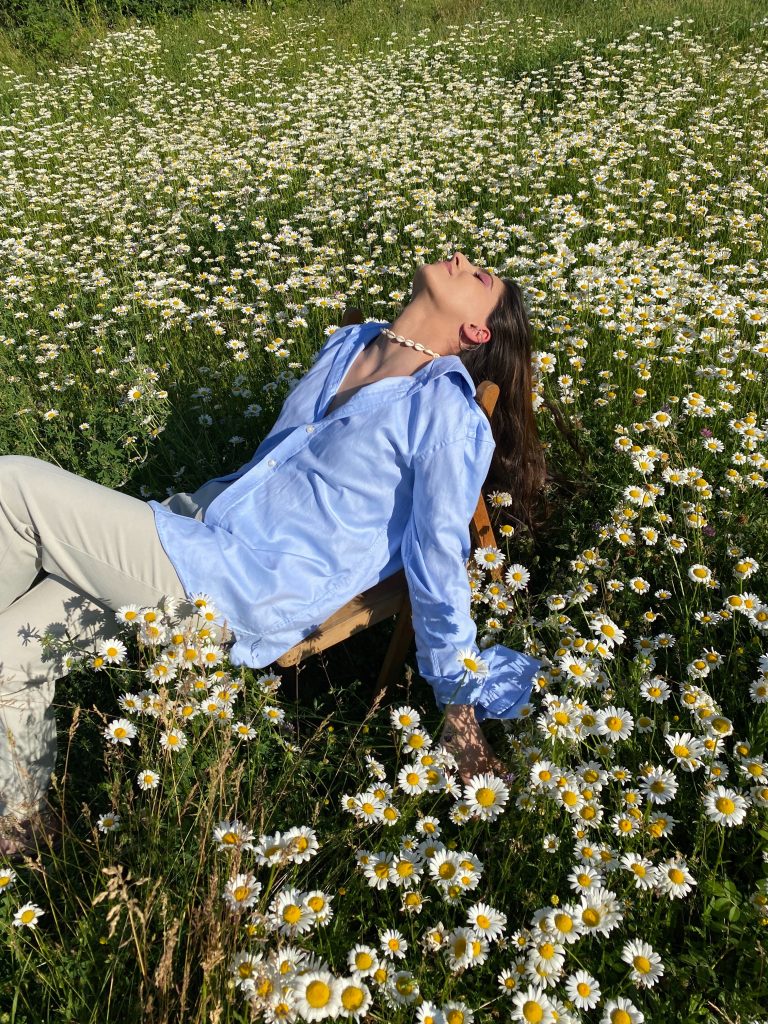 woman laying in flowers