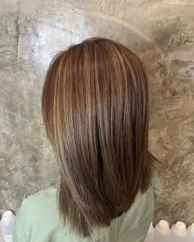 ash blonde highlights contrast with ash dark brown hair
