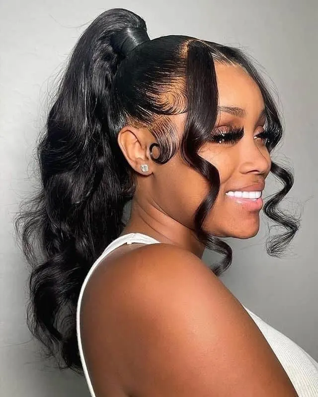 high ponytail with strands pulled out