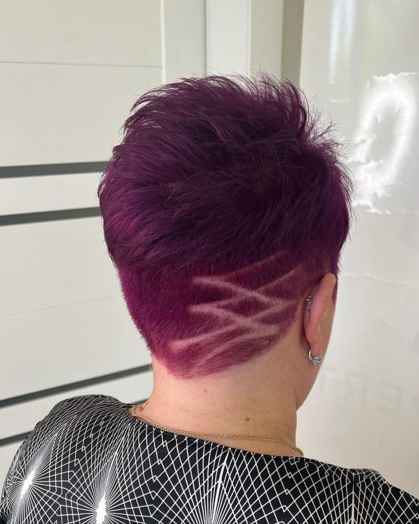 purple pixie with undercut and tattooed neck area