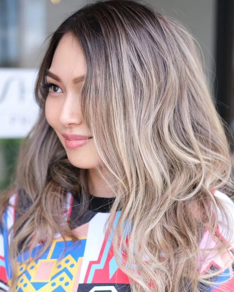 cool-toned blonde highlights with root melt