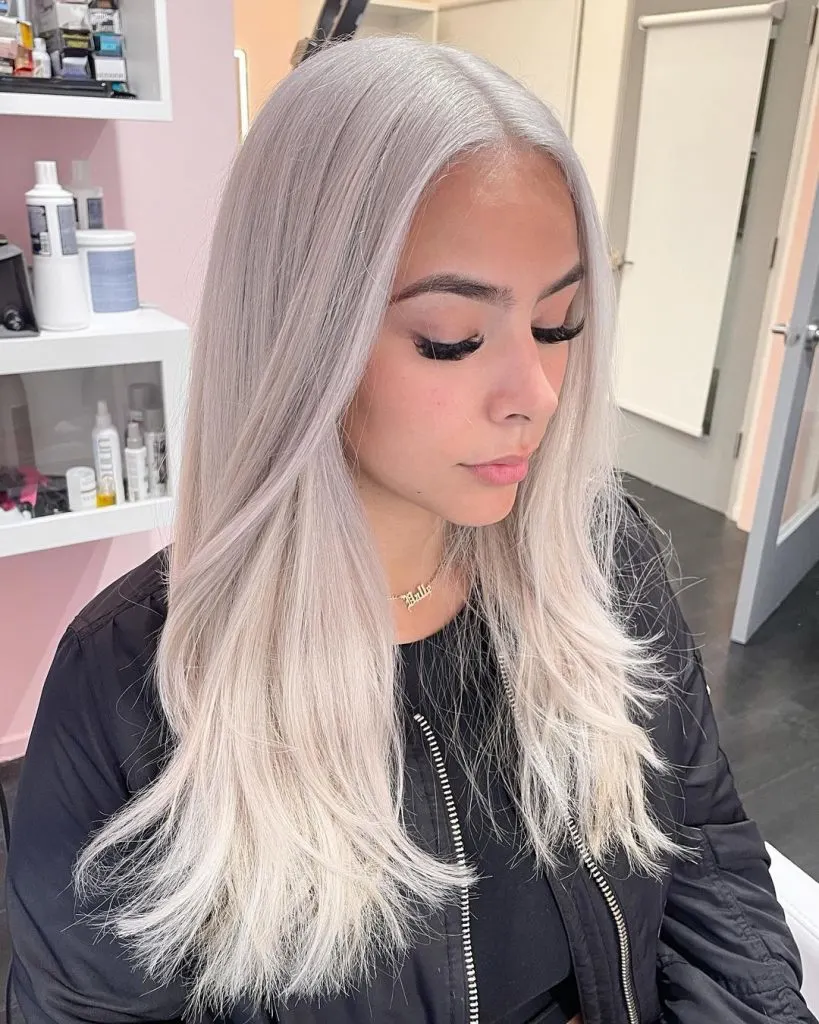 platinum blonde long hair with middle part
