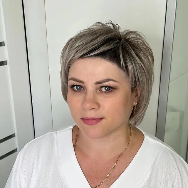 ash blonde short cut with baby bangs