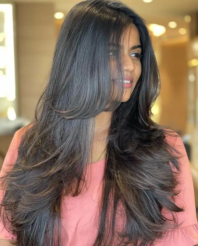 long textured layers with side swept bangs