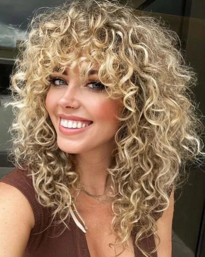 medium curly hair with bangs