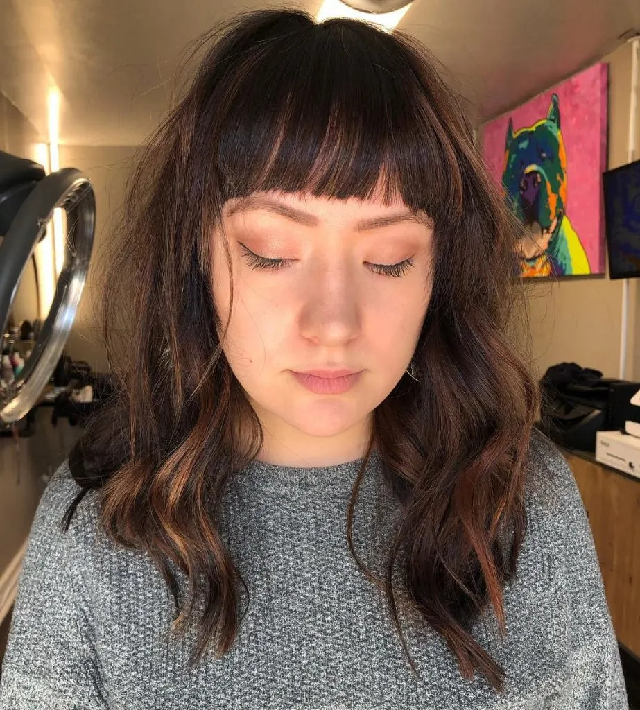 mid-length hair with blunt bangs