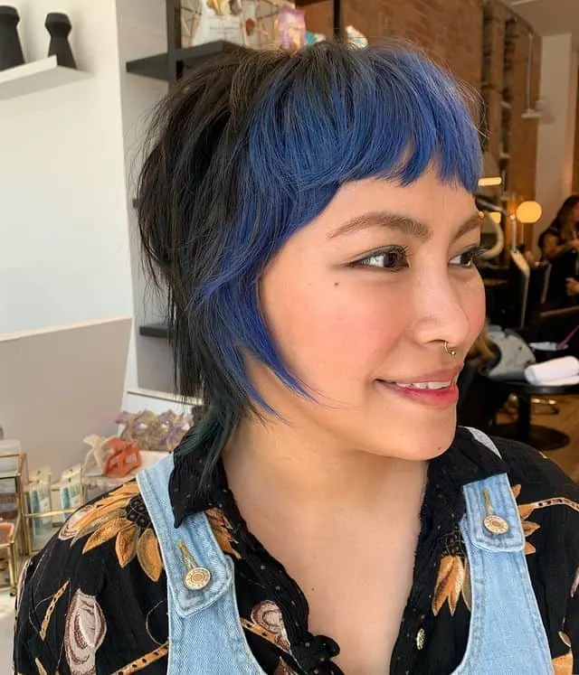 piecey short wolf cut with colored bangs for round face