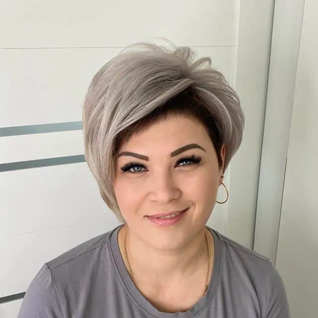 short ash blonde hairstyle with dark roots