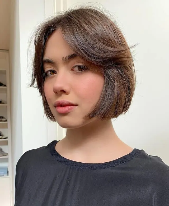 short bob cut with flipped curtain bangs