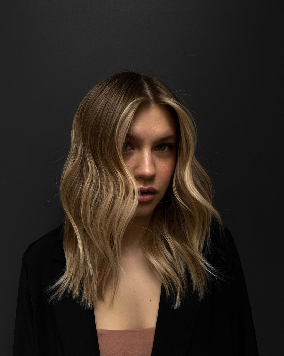 dirty blonde hair with face-framing highlights
