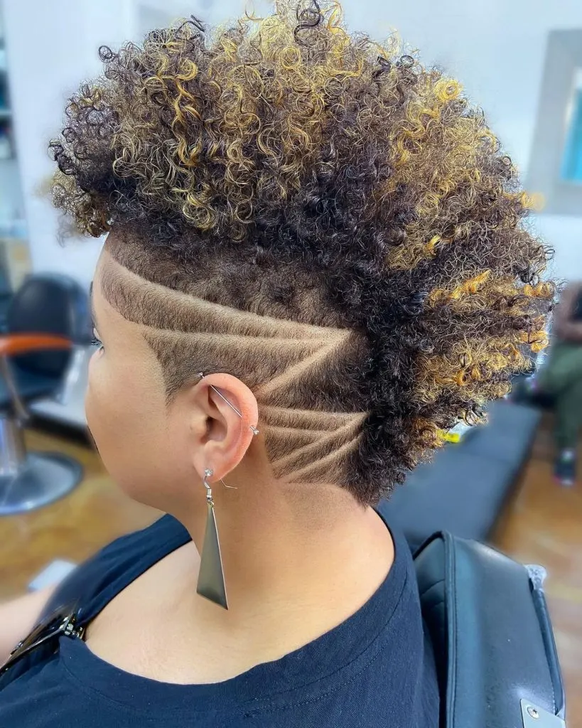 blonde highlights on edgy curly short dark hair