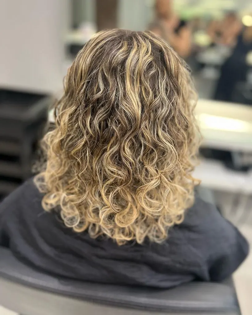 honey blonde curly hair