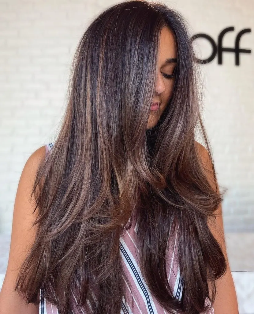 medium brown hair with light caramel highlights