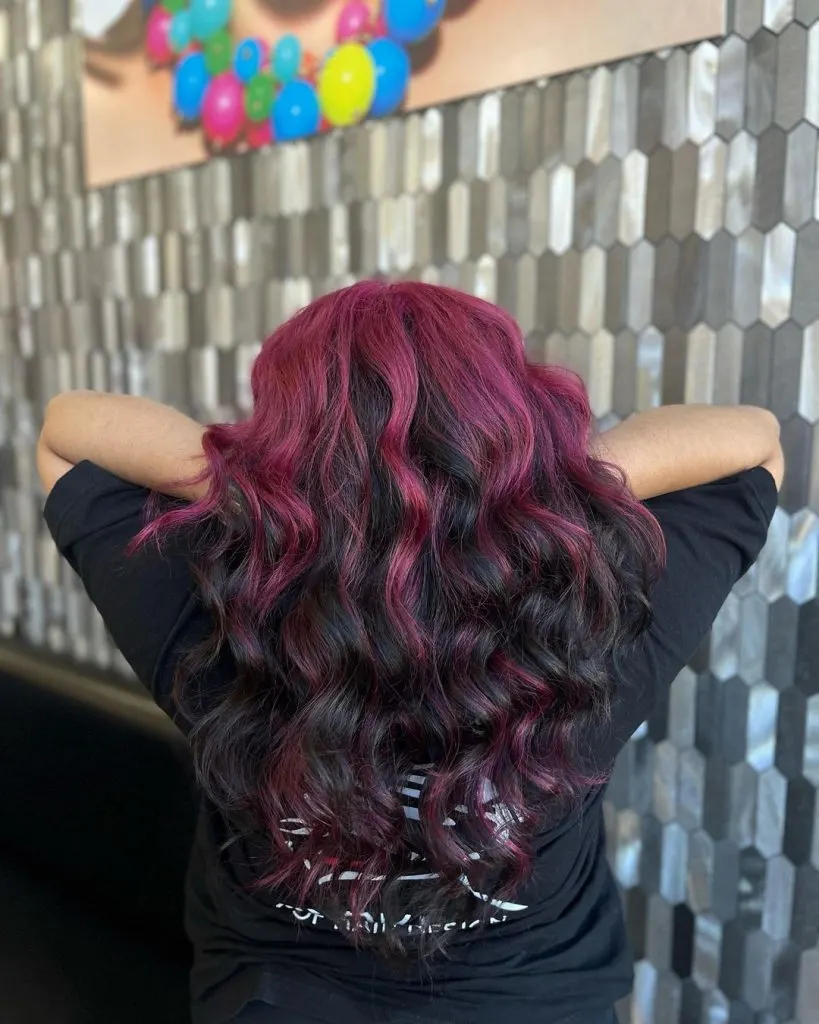 black hair with magenta roots