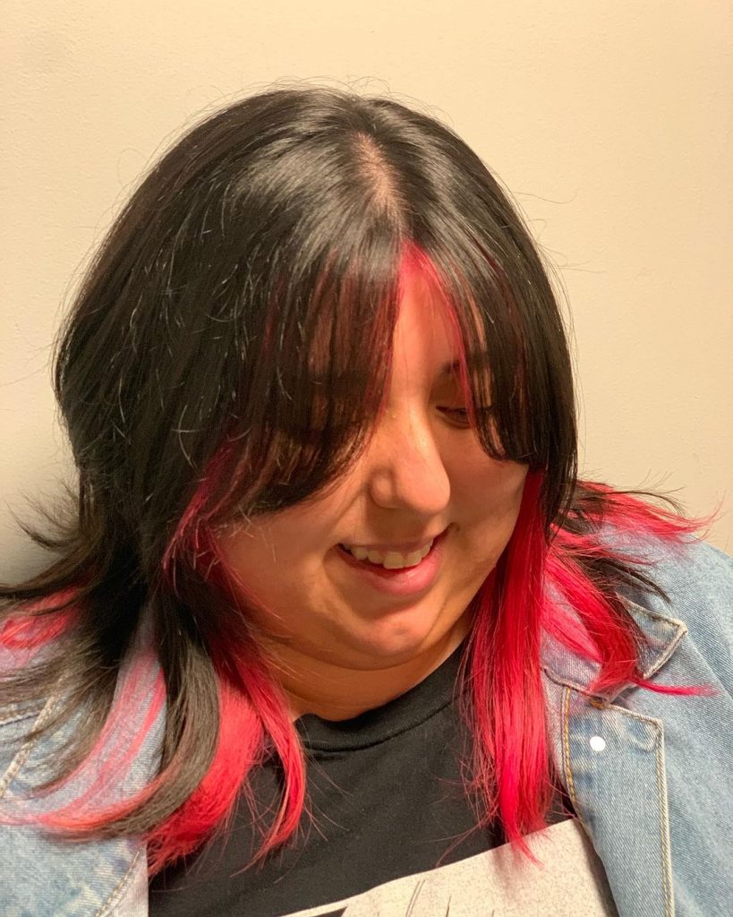 black hair with pinkish red tips
