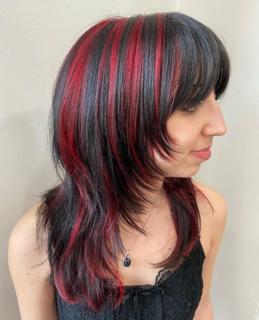 black wolf cut with red highlights
