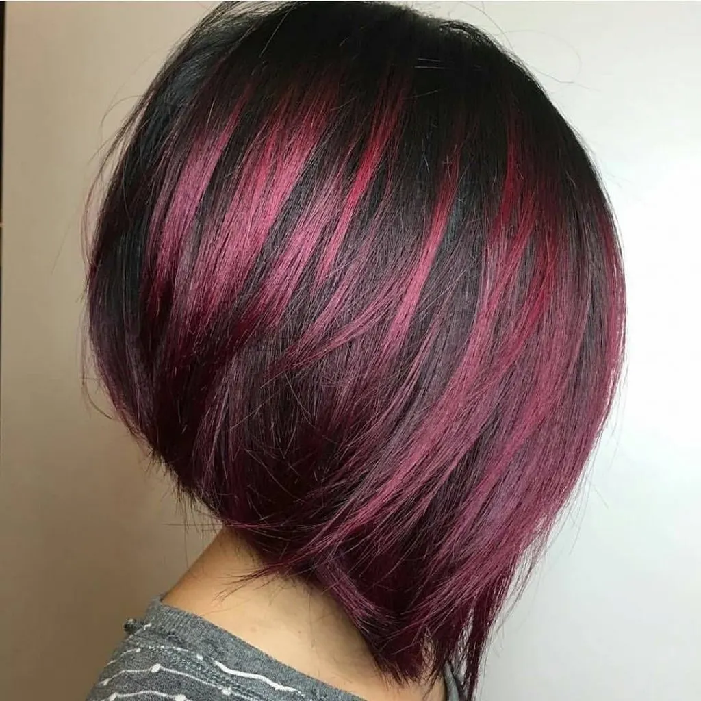 bob cut with magenta highlights