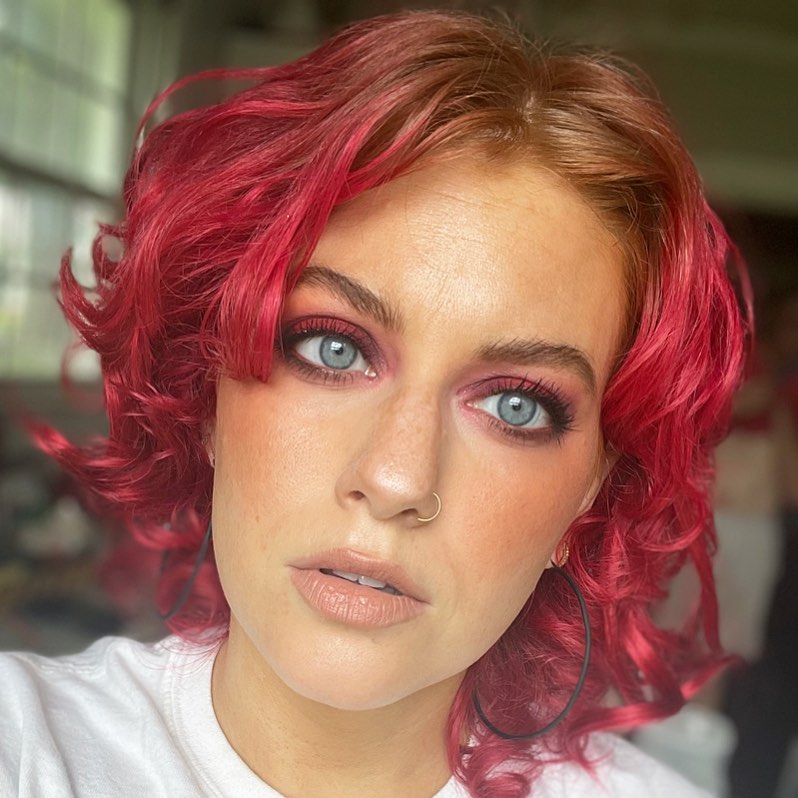 bright red curly bob with light root