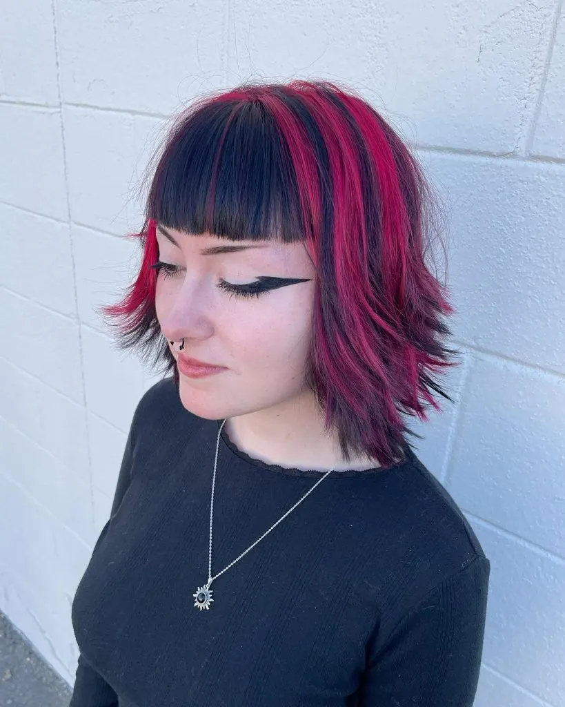bright red highlights and black bangs