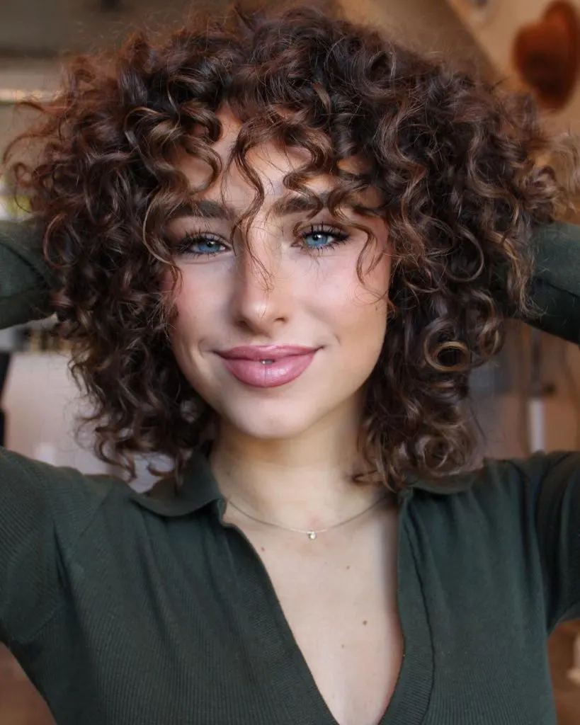 curly hair with choppy bangs