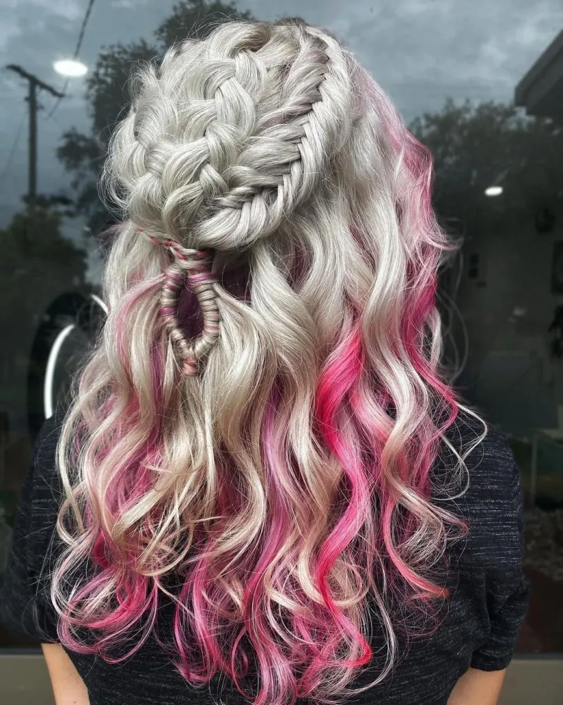 long ash blonde curls with braids and pink highlights