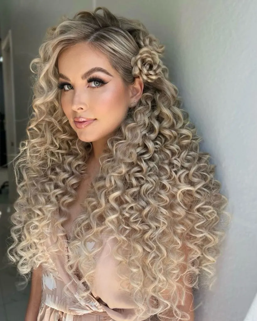 long curly hair with a Dutch flower braid