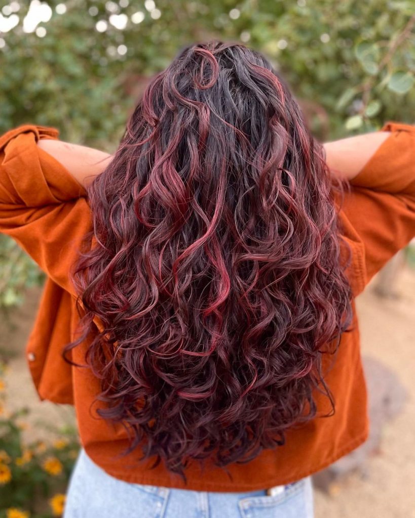 long dark loose curls with rich burgundy tones