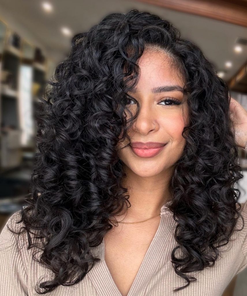 long black side parted curly hairstyle
