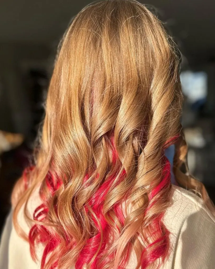 naturally blonde hair with bright red locks