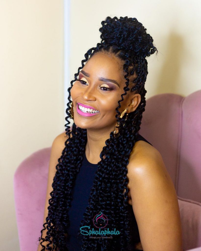 a woman with passion twist braids 