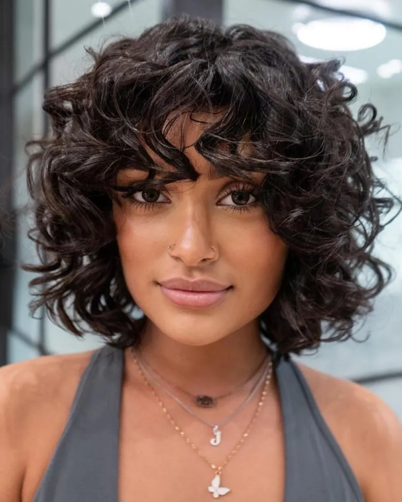 short layered curly hair with bangs

