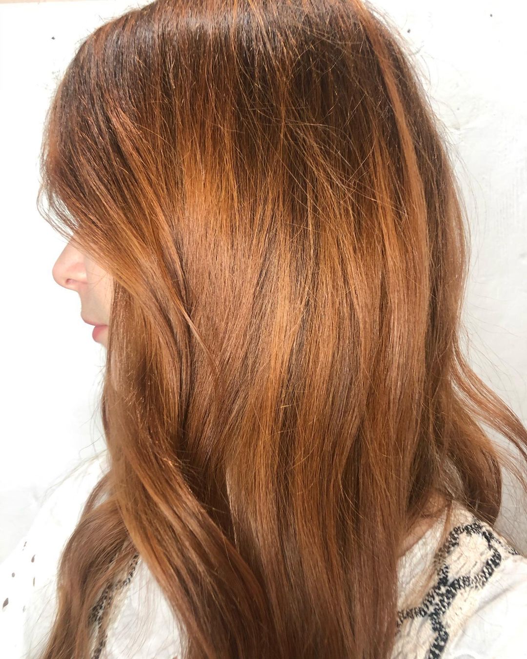 copper brown hair with golden accents