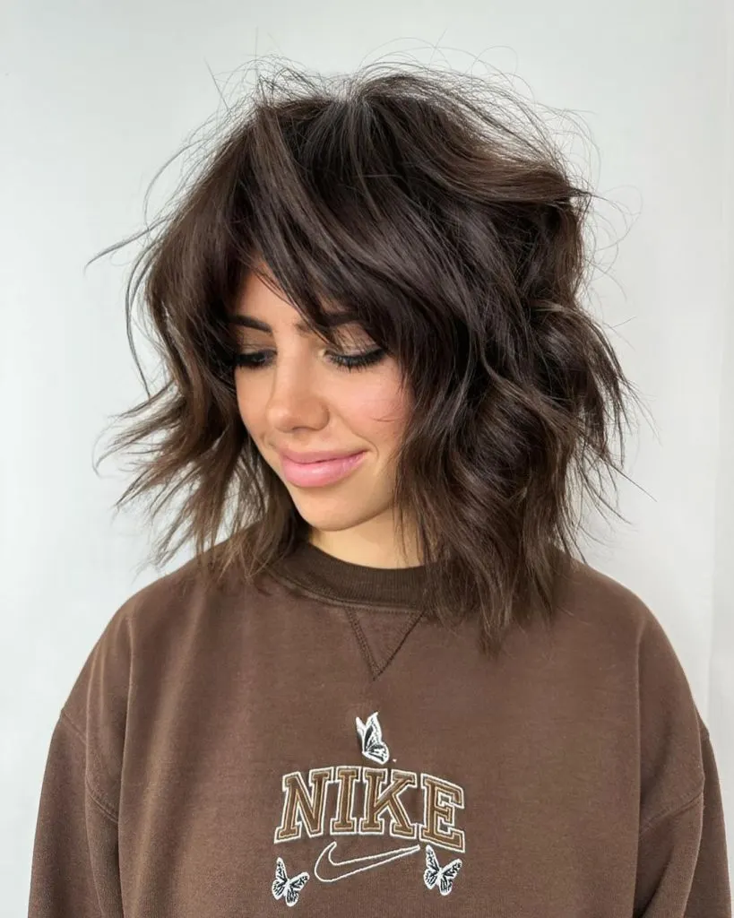 Dimensional Brunette With Layers And Curtain Bangs 