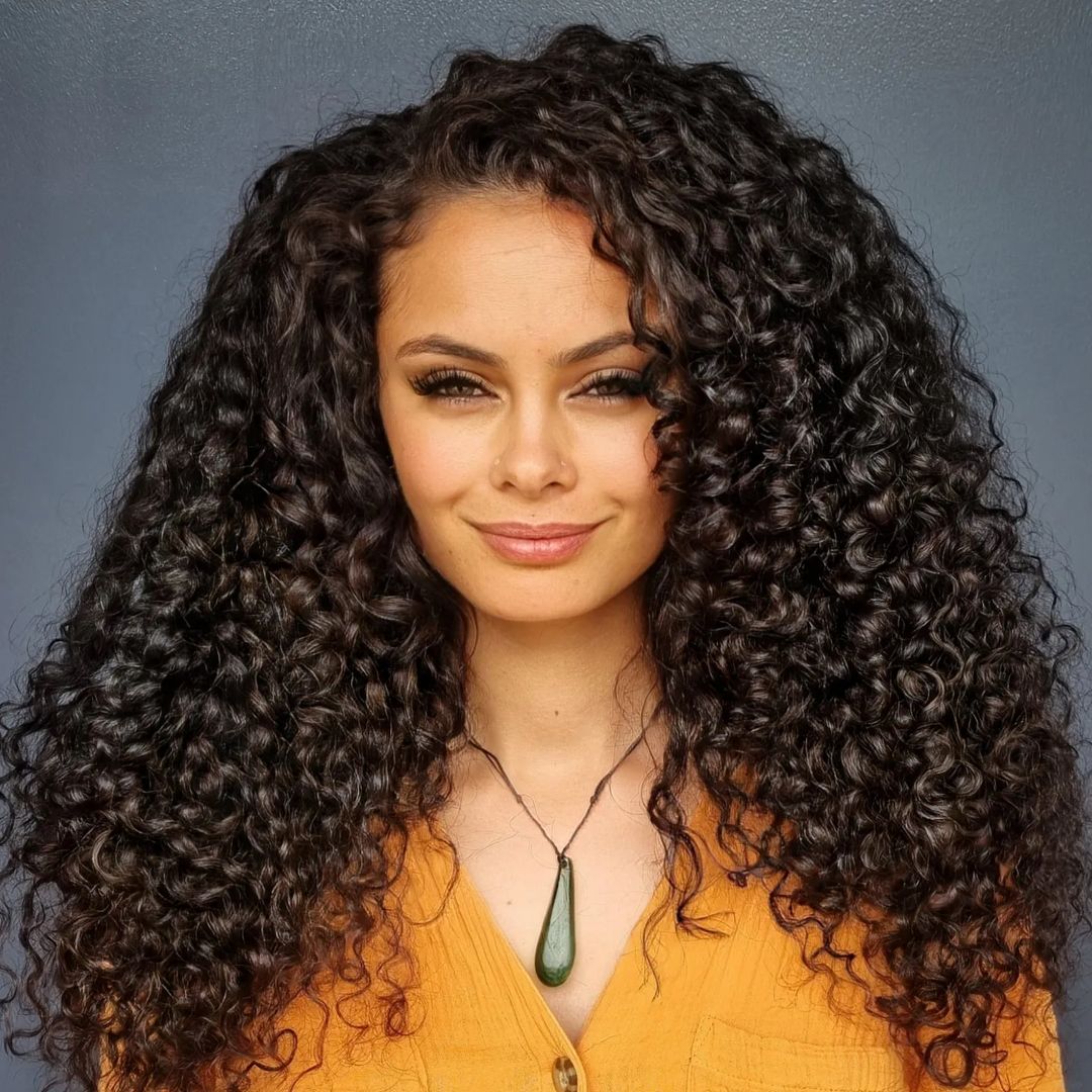 long curly hair with face framing layers