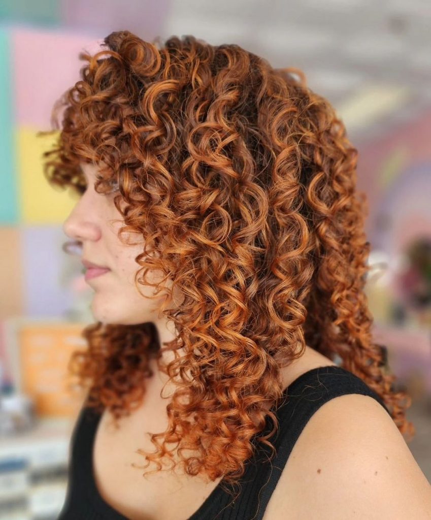 cowboy copper curly hairstyle