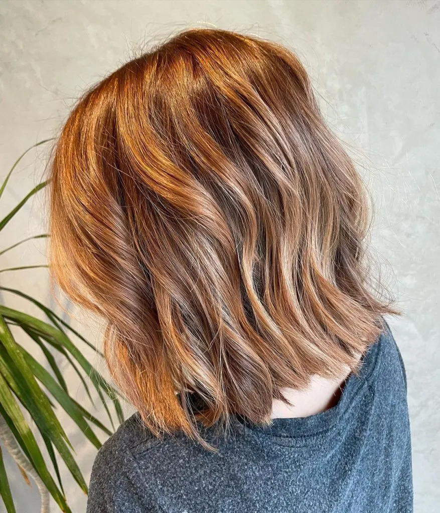 cowboy copper bob cut with highlights and lowlights
