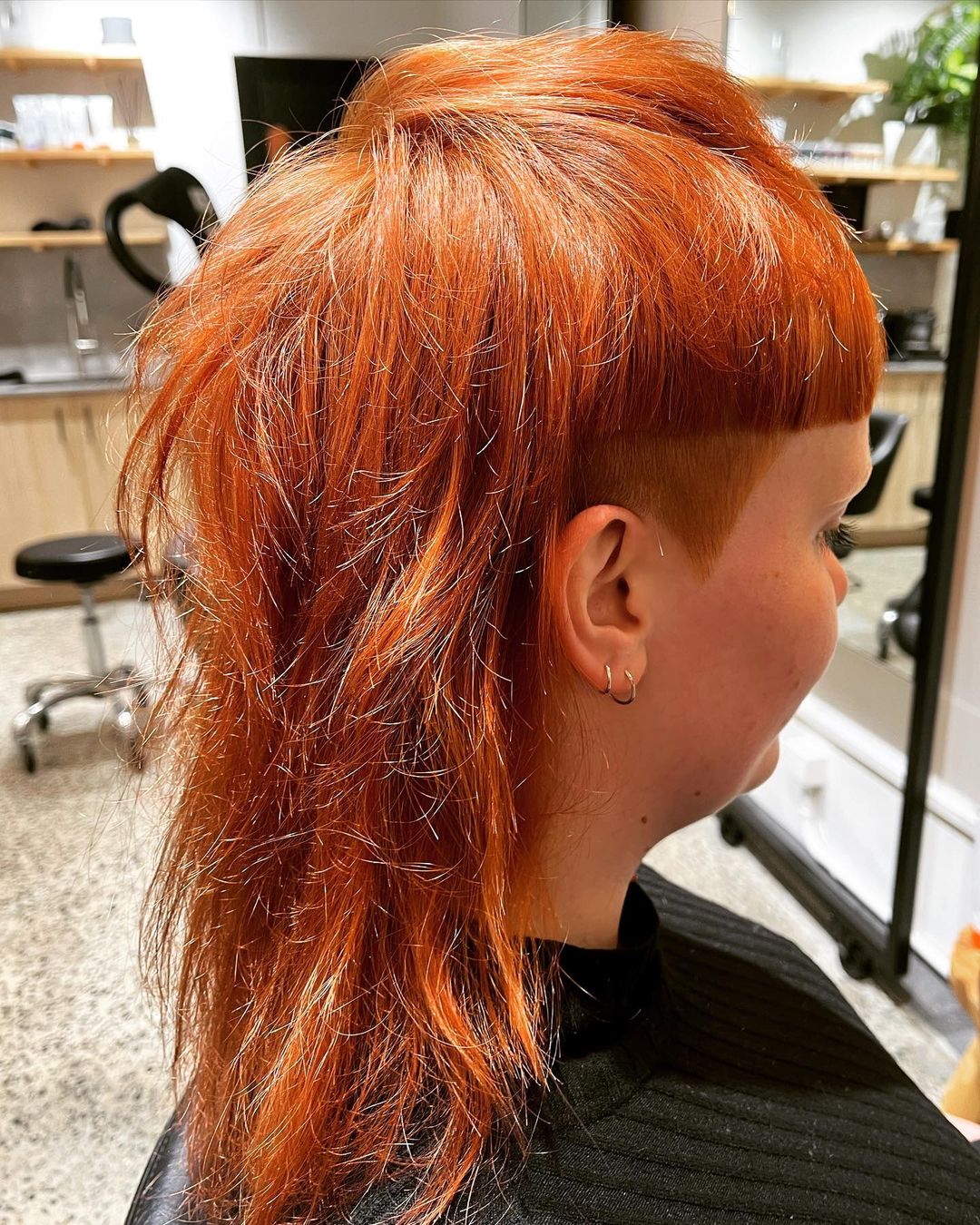 dark ginger edgy mullet with undercut