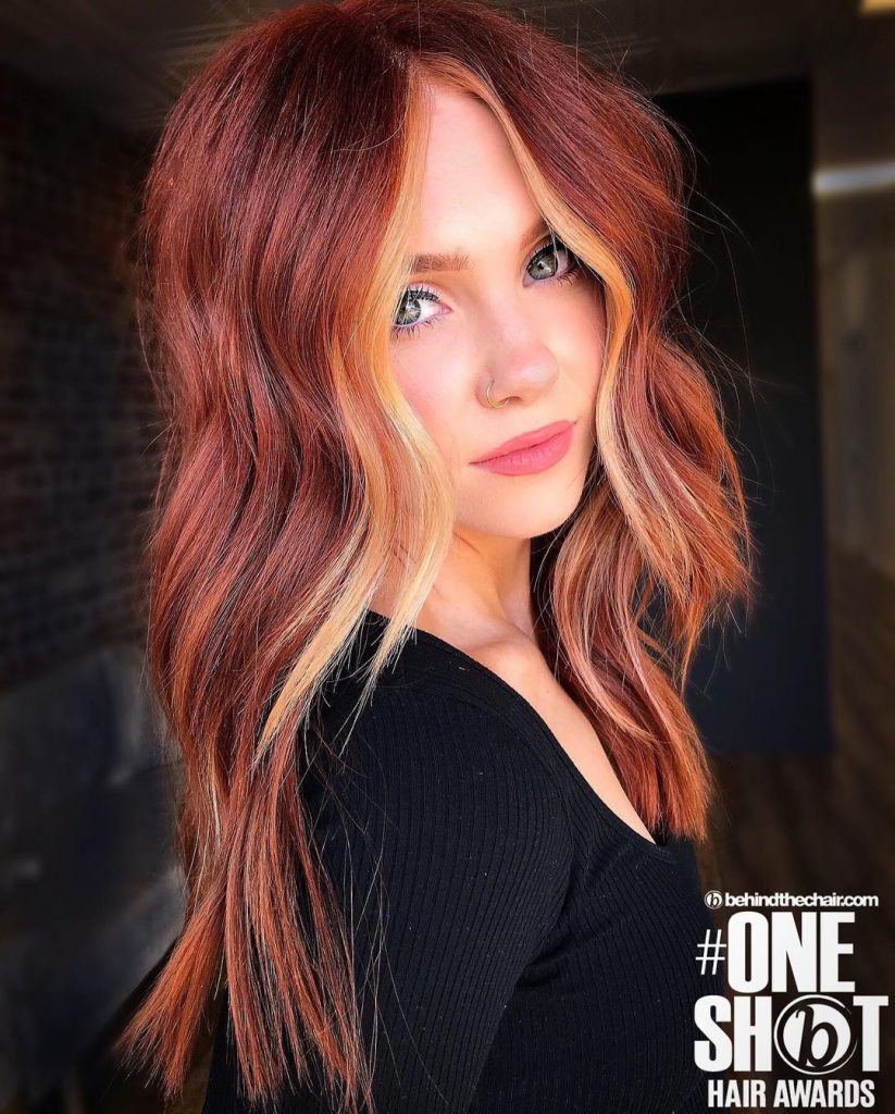 dark red hair with strawberry blonde face framing highlights