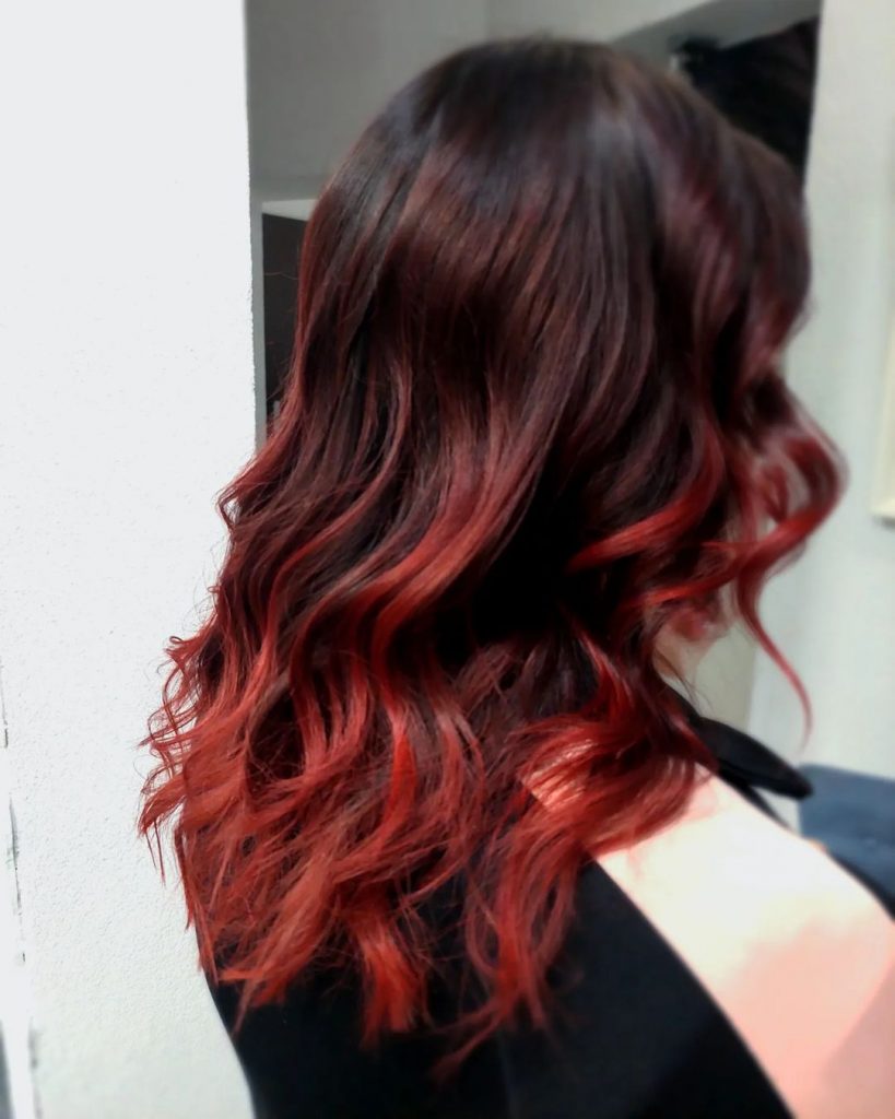 deep dark brown hair with cherry red balayage