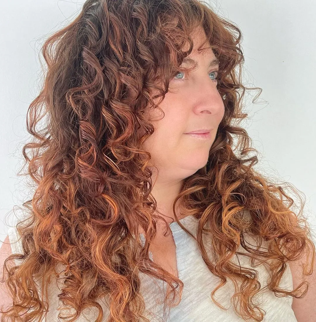 long curls with heavy face framing shaggy layers