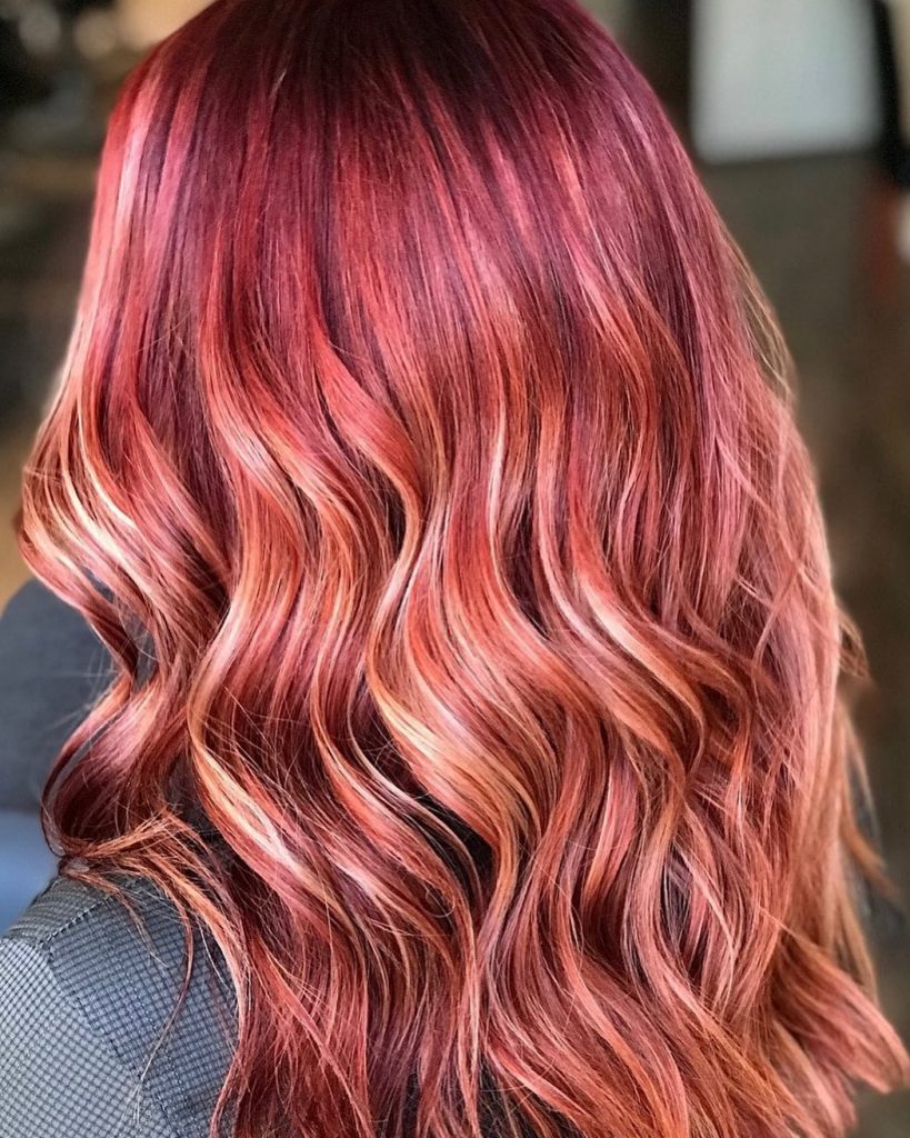 pinkish red hair with blonde highlights