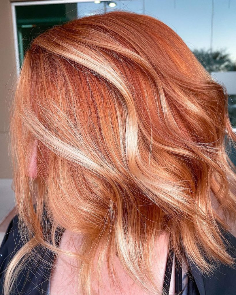 red hair with dimensional blonde highlights