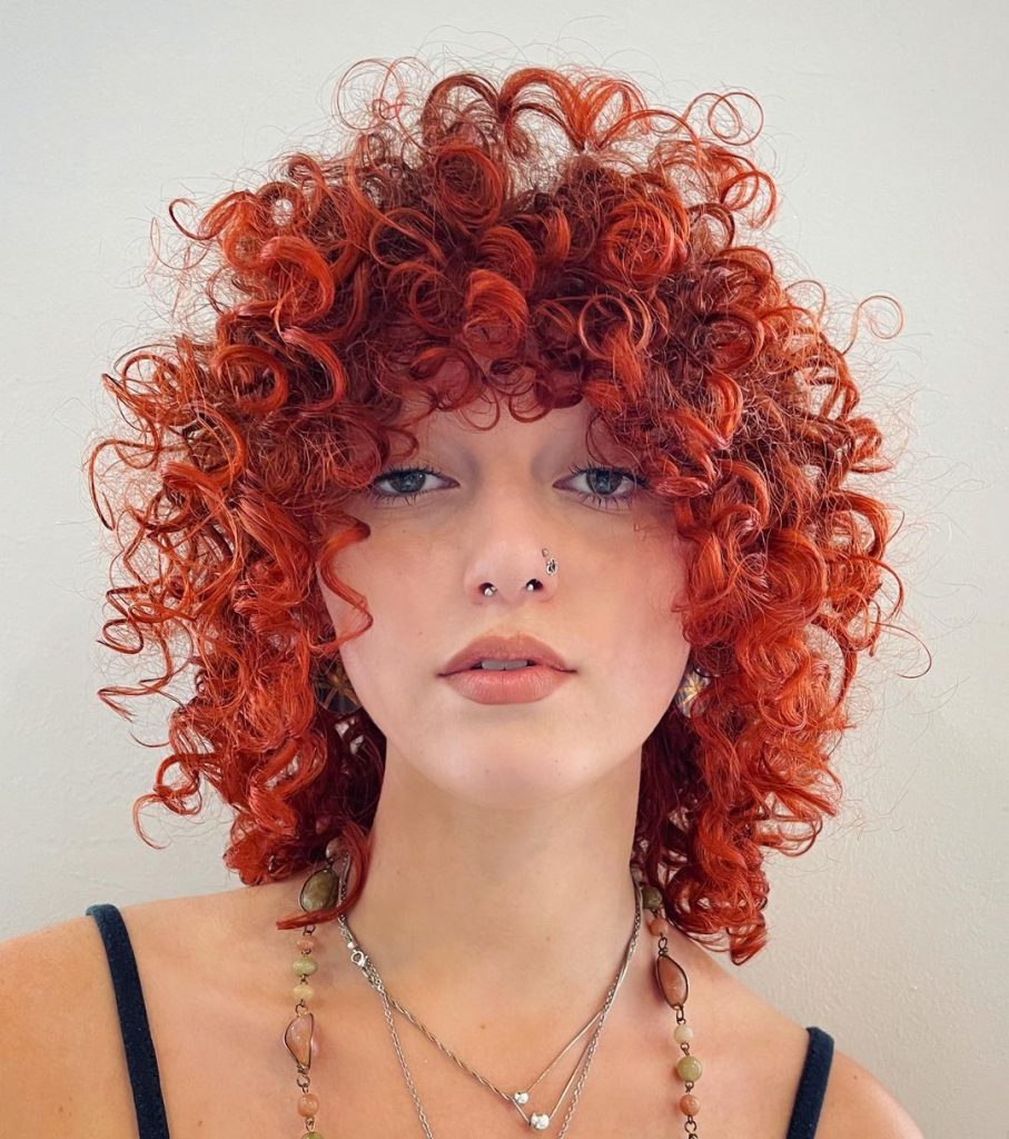 vibrant red curly shag
