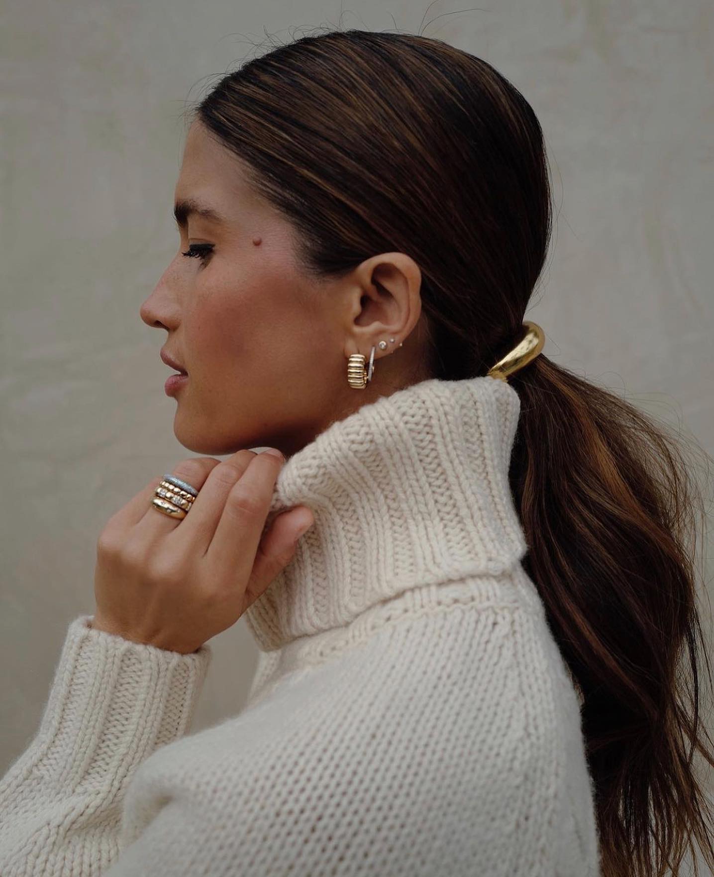 slick-back ponytail with ring