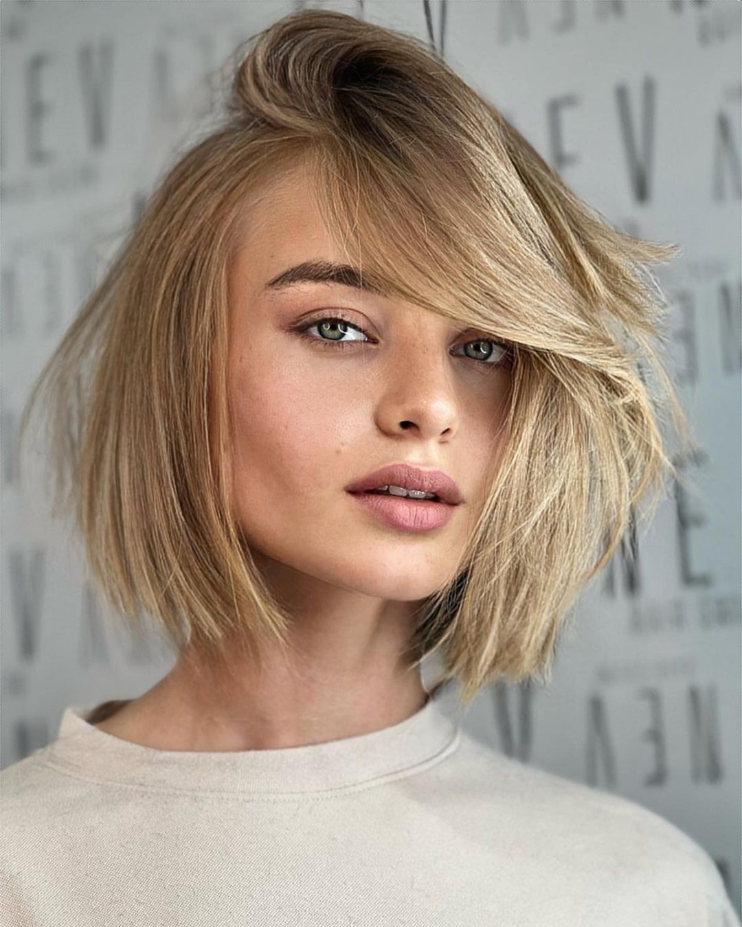 short blond bob with root tap