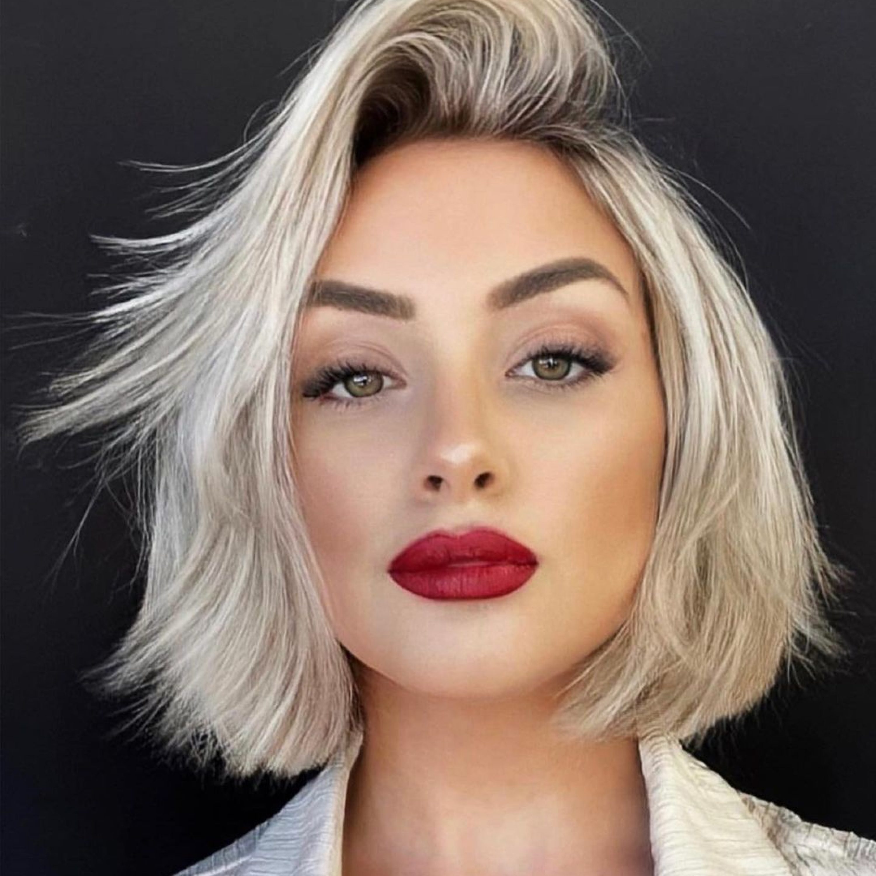 short blonde bob with side part