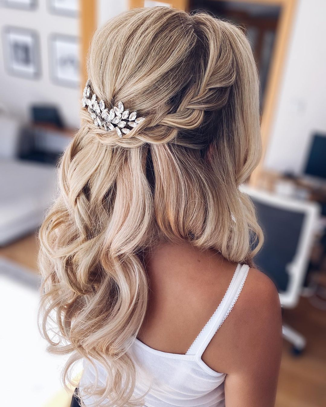 half up half down wedding hairstyle with a loose braid