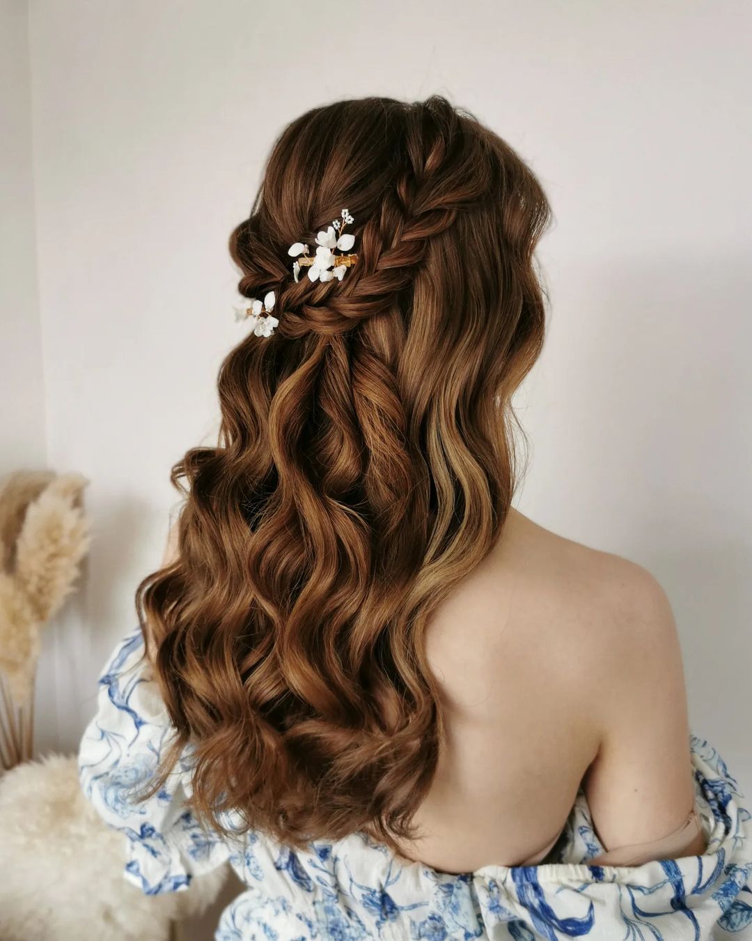 Grecian half up half down wedding hairstyle with braid and flower